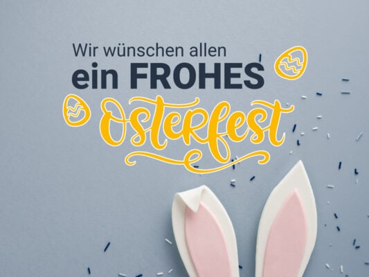 Osterfest Grußkarte mit Hasenohren und Ostereiern, passend für Ostern 2023.